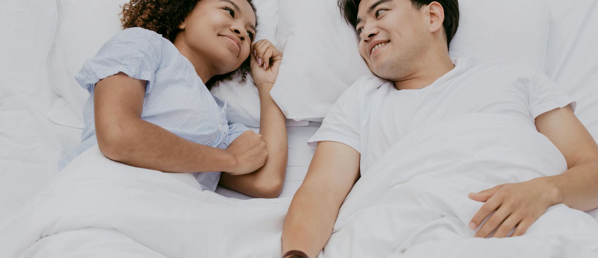 A Couple Lying Down on a Matress